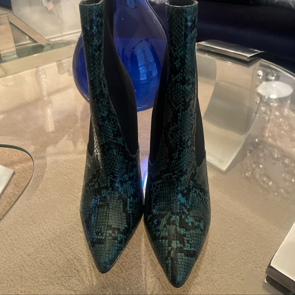 Brand new heel boots faux snake skin green and black 4’ inch boot.